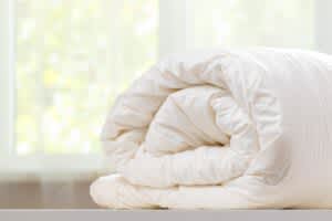 stock photo of a rolled up duvet cover