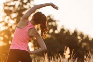 stock photo of a woman exercising outside in the early evening