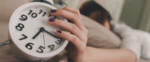 stock photo of a person holding a clock