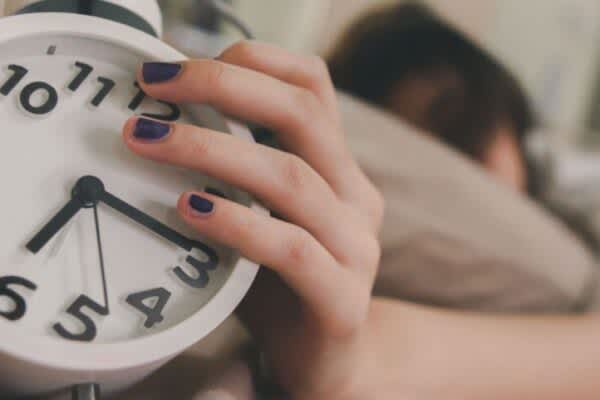 stock photo of a person holding a clock