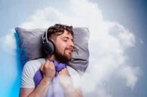 stock photo of a man sleeping with headphones on