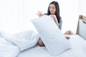 stock photo of a woman with a dirty pillow