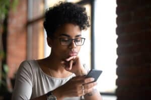 woman looking at her phone