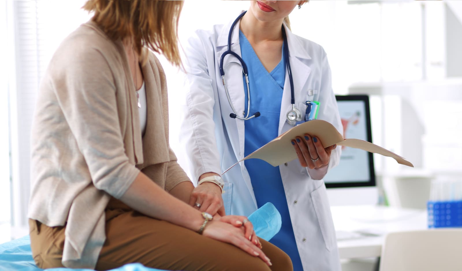 a patient talks with their doctor