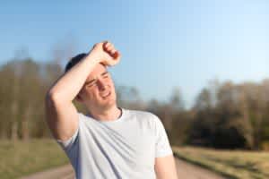 stock photo of a man tired from being in the sun