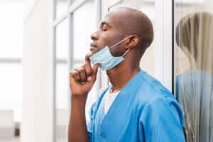 Tired medical worker resting after procedure