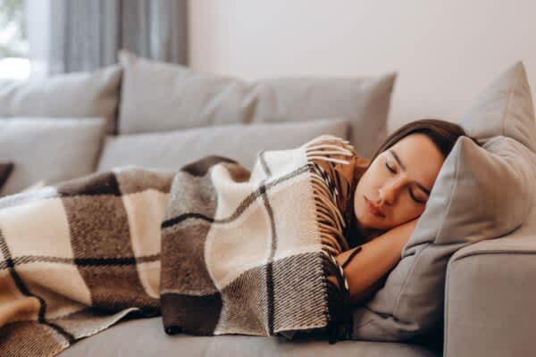 person taking a nap on a couch