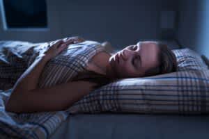 stock photo of a woman laying in bed