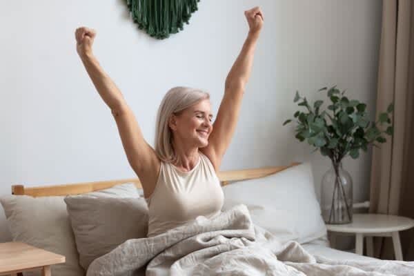 older woman waking up with a lot of energy